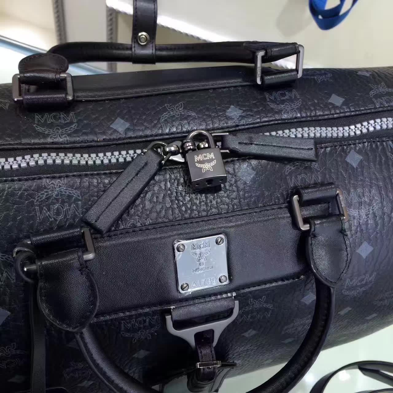 MCM男包 Nomad系列旅行袋 PVC配牛皮内里猪皮 铜牌独立编码 黑色